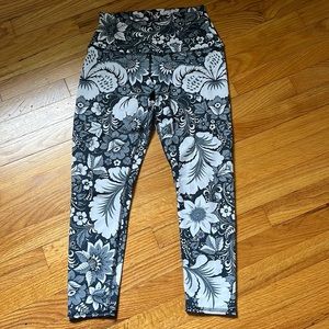 Medium, grey/blue floral patterned leggings.